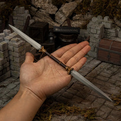 Twinblade replica (30cm die-cast zinc alloy sword) — held in hand for scale.
