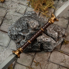 Twinblade replica — wrapped grip and gold end-cap detail close-up.