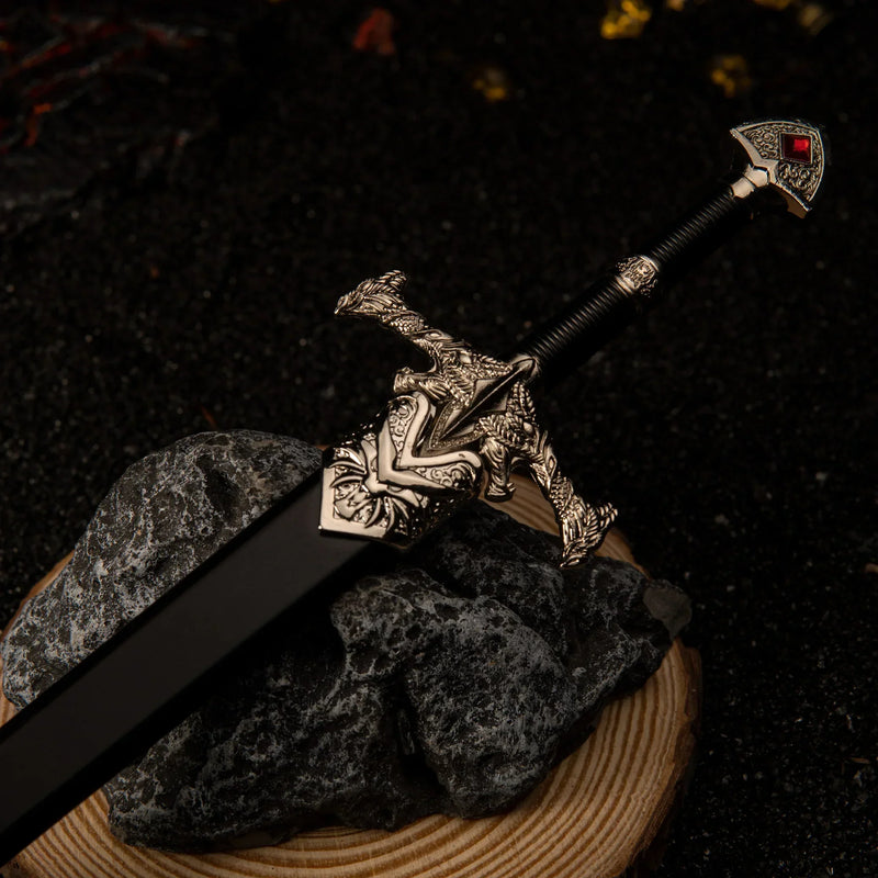 Blackfyre replica — hilt and black scabbard together on volcanic rock.