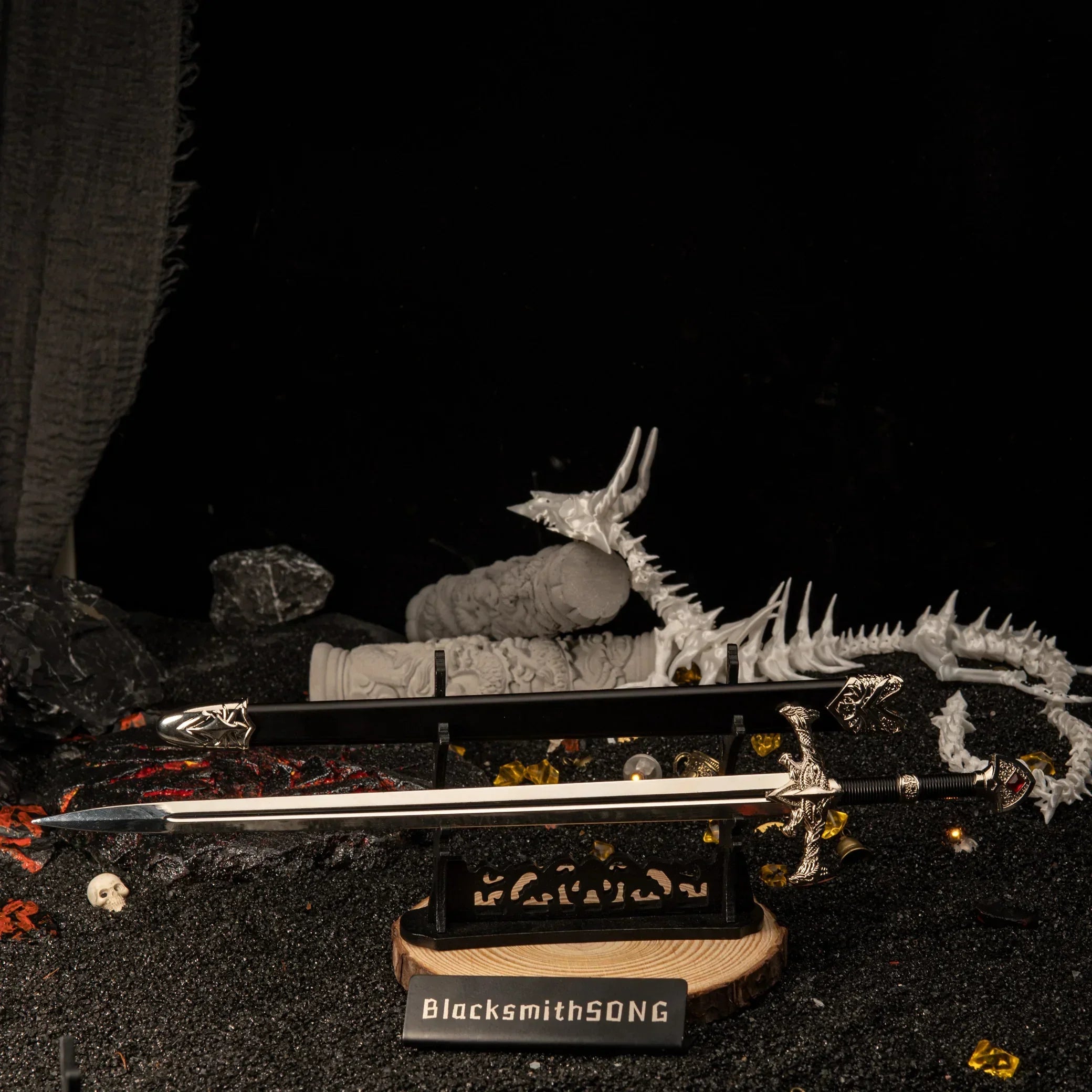 Side profile of the Blackfyre metal sword resting on a decorative display base.