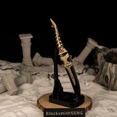 Catspaw Dagger replica — standing upright on the vertical stand.