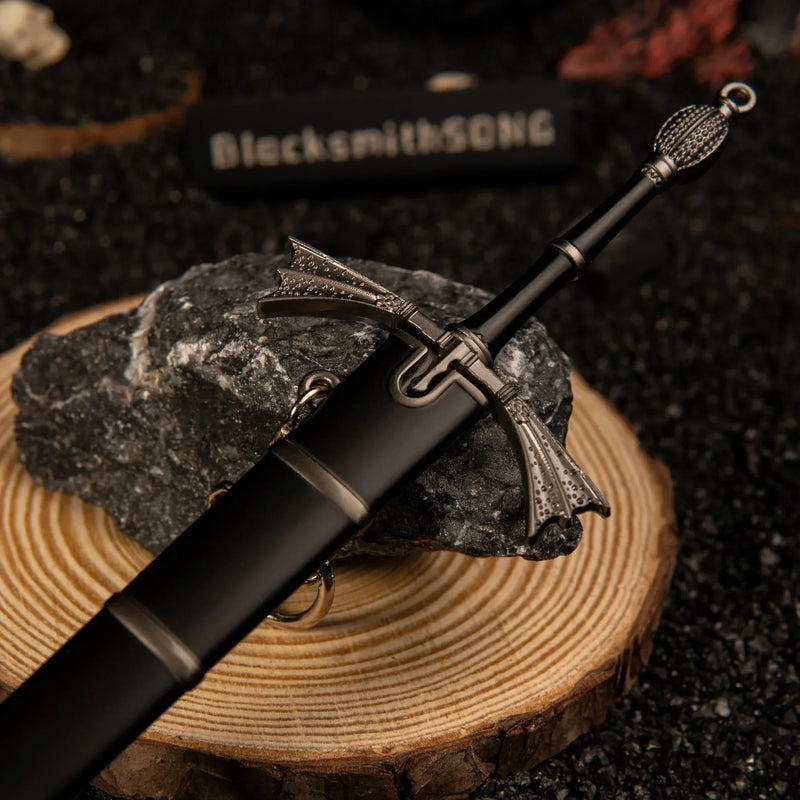 Dark Sister replica — winged crossguard and hilt detail on a wood round.