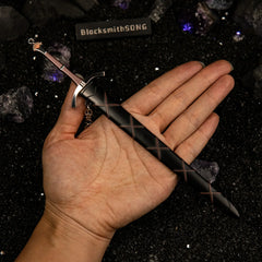 Dawn Sword replica (22cm die-cast zinc alloy sword) — held in hand for scale.