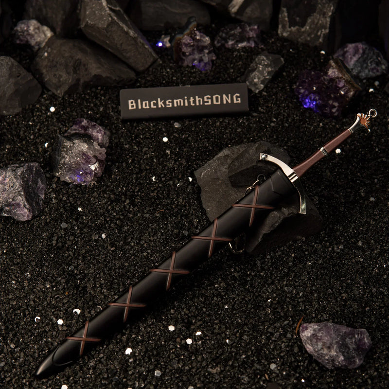 Dawn Sword replica — sheathed in its cross-laced black scabbard on dark sand.