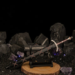 Dawn Sword replica — displayed on the small stand on a round wooden base.