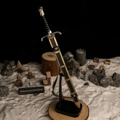 Longclaw replica — standing point-down on the vertical stand.