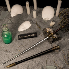 Needle replica (30cm die-cast zinc alloy sword) — hero shot beside its scabbard in a handcrafted candlelit diorama, by BlacksmithSONG.