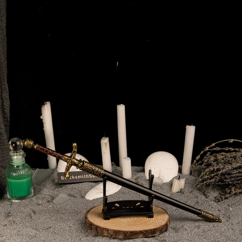 Needle replica — resting on the small display stand.