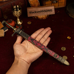 Oathkeeper replica (30cm die-cast zinc alloy sword) — held in hand for scale.