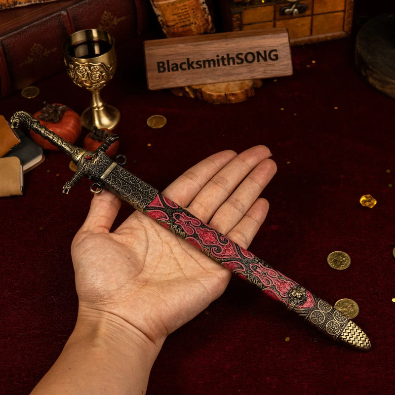 Oathkeeper replica (30cm die-cast zinc alloy sword) — held in hand for scale.