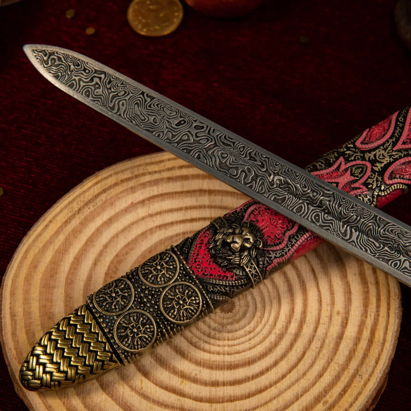 Oathkeeper replica — scabbard filigree panels and lion medallion, close-up.
