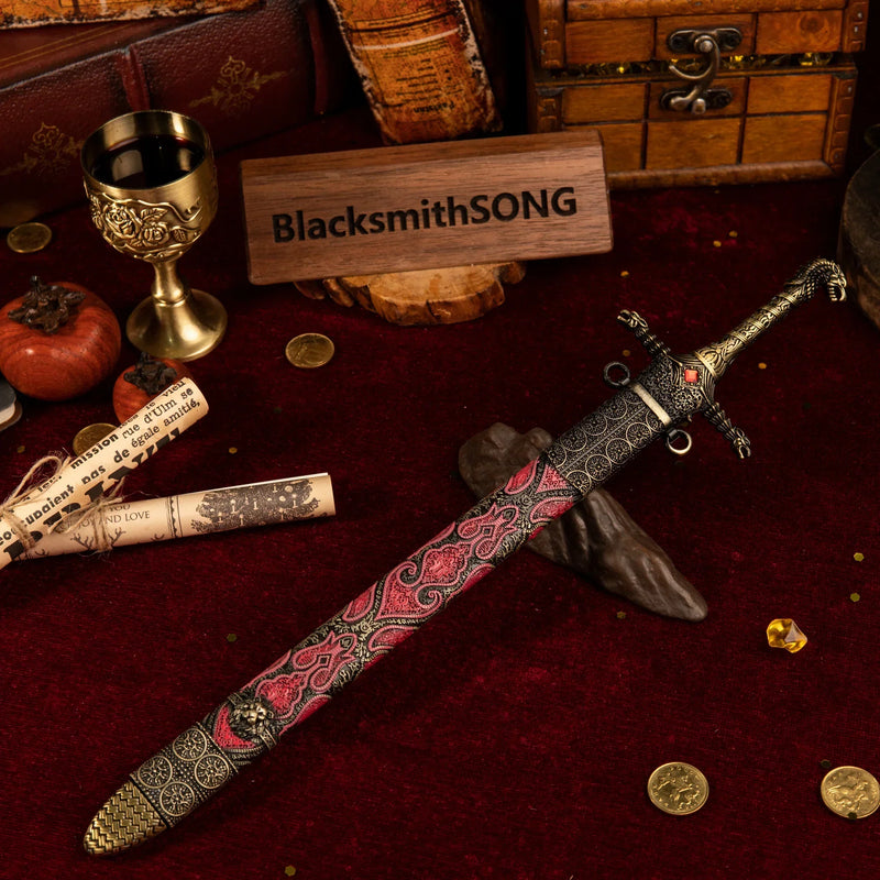 Oathkeeper replica — sheathed in its red-and-gold scabbard beside a rolled scroll.