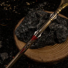 Draupnir Spear replica — full length laid on a wood round, showing the tapered shaft.