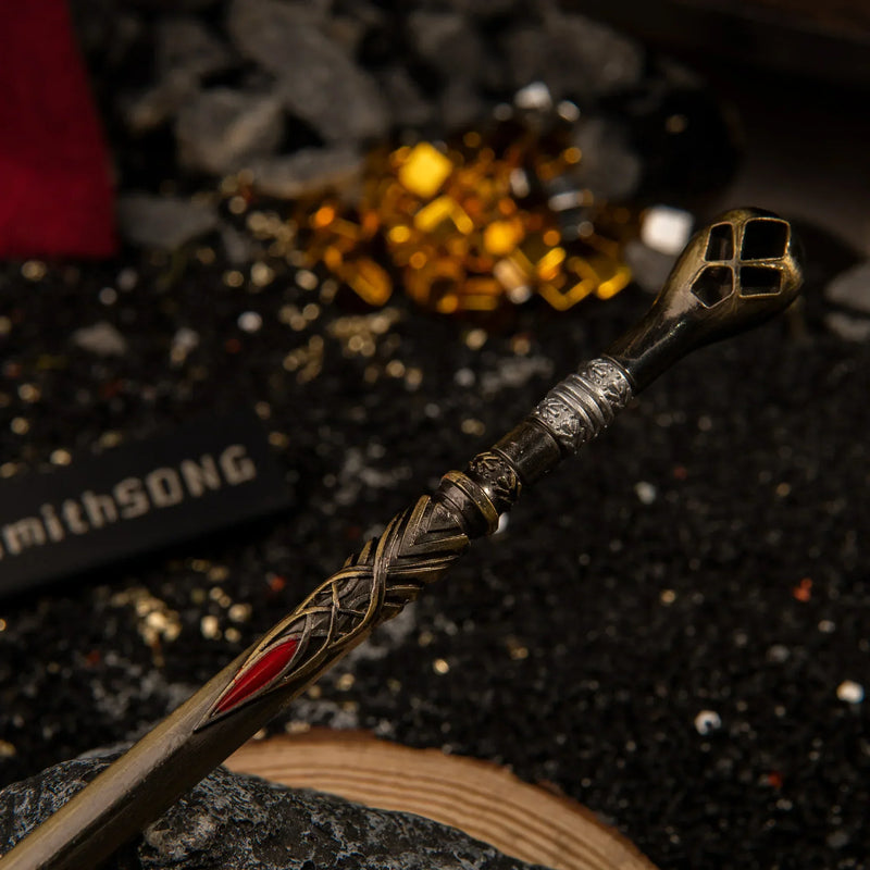 Draupnir Spear replica — pommel and butt end close-up beside raw gold ore.