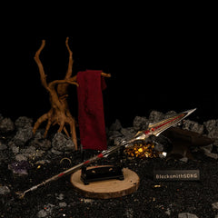 Draupnir Spear replica — displayed on the small stand near the gold ore cluster.