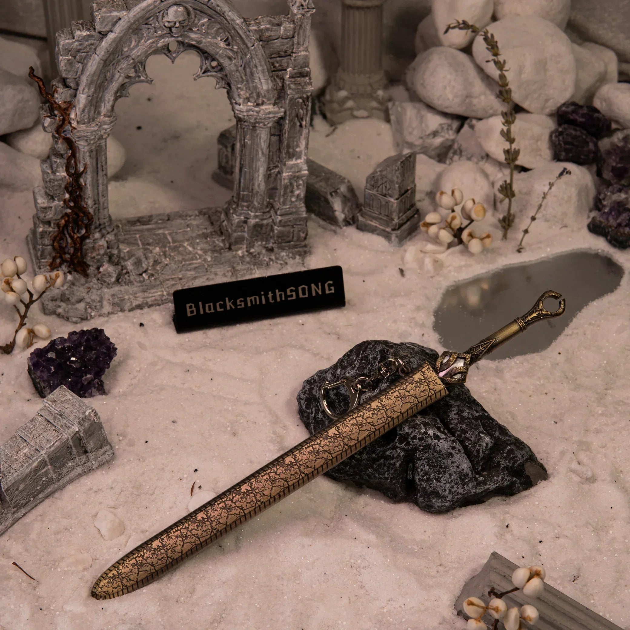 Alternate view of the God of War Ingrid metal replica sword with engraved hilt and bronze blade in a ruins diorama.