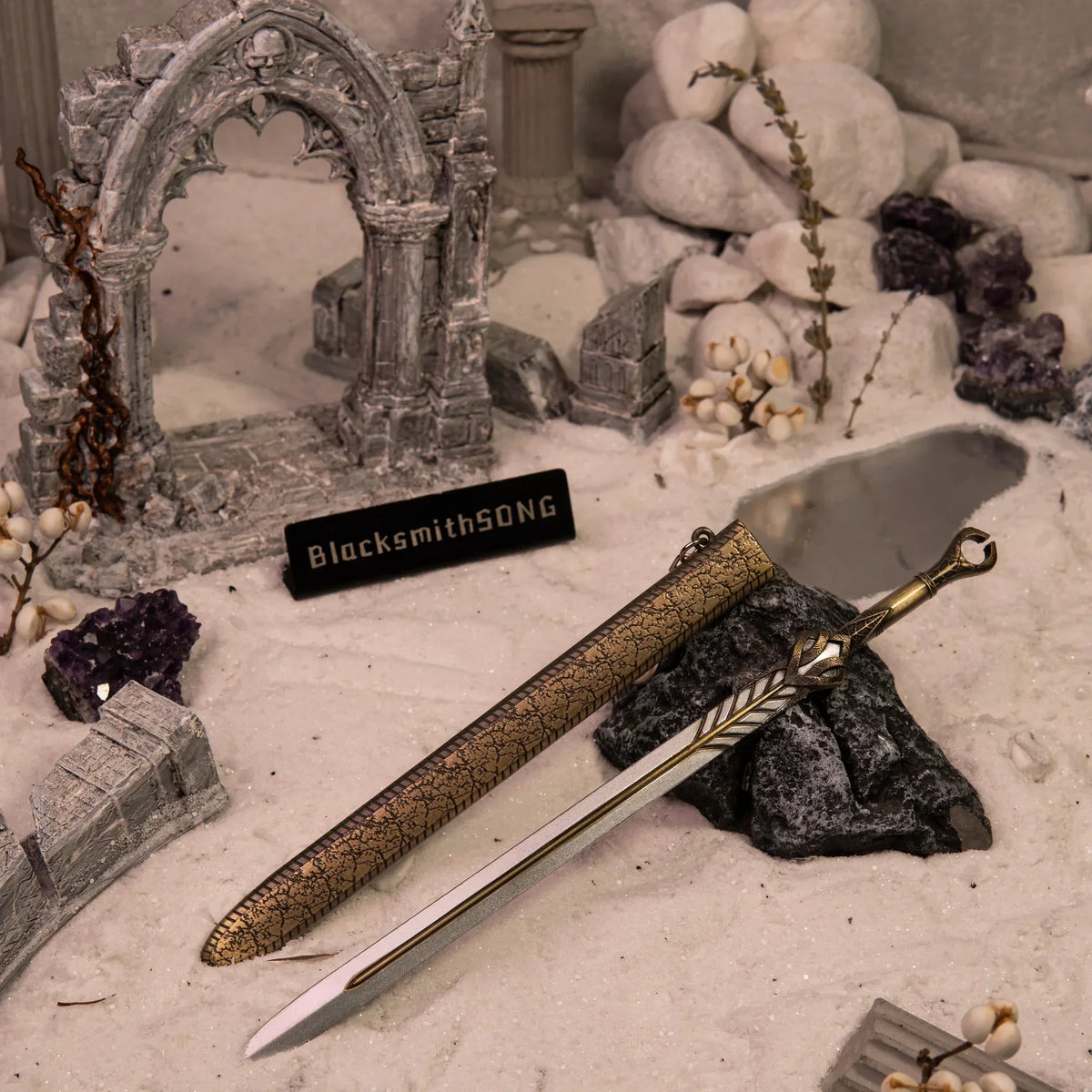 God of War Ingrid metal replica sword displayed in a gothic ruins diorama with white sand and amethyst, by BlacksmithSONG.