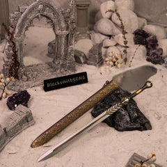 Ingrid replica (22cm die-cast zinc alloy sword) — hero shot in a snow-covered ruin, by BlacksmithSONG.