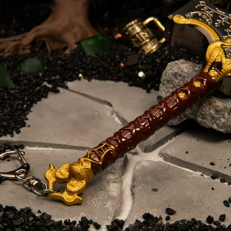 Mjolnir replica — grip and serpent-head flourish close-up.