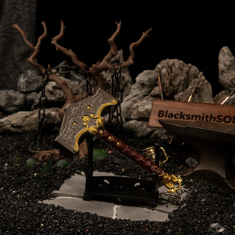 Mjolnir replica — displayed on the small stand beside the anvil.