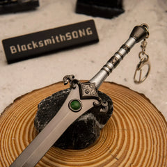 Skofnung replica — crossguard and green gem detail, close-up.