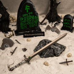 Skofnung replica (22cm die-cast zinc alloy sword) — hero shot in a handcrafted graveyard diorama, by BlacksmithSONG.