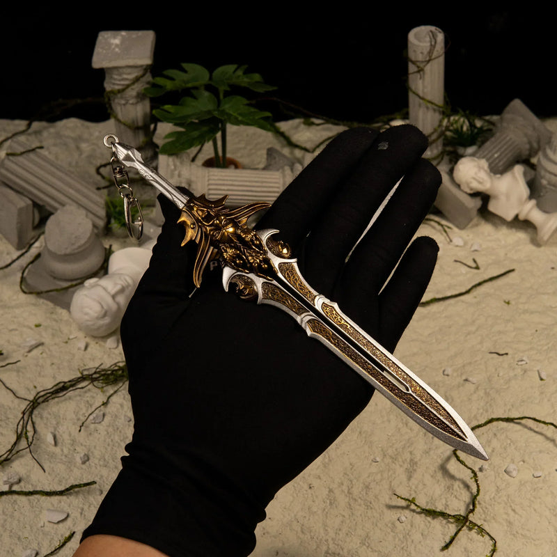 Blade of Olympus replica (21cm die-cast zinc alloy sword) — held in hand for scale.