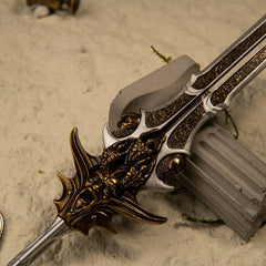 Blade of Olympus replica — dragon-faced crossguard close-up.