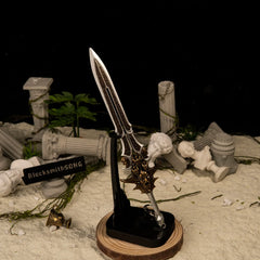 Blade of Olympus replica — standing upright on the vertical stand.