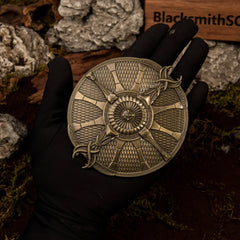 Guardian Shield replica (10cm die-cast zinc alloy shield) — held in hand for scale.