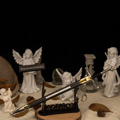 Andúril replica — laid across the large display stand beside the white angel statues.