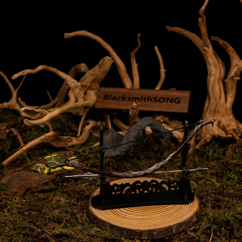 Bow of the Galadhrim replica — angled view on the large display stand beneath the tangled roots.