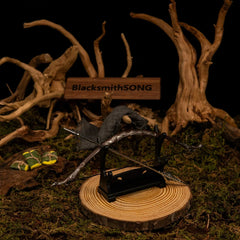 Bow of the Galadhrim replica — set on the small display stand against the mossy backdrop.
