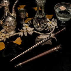 Galadriel Sword replica (30cm die-cast zinc alloy sword) — laid on a reflective glass set with silver vessels and pearls, by BlacksmithSONG.