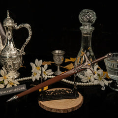 Galadriel Sword replica — laid across the large display stand beside the silver ewer.