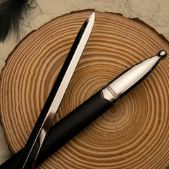 Glamdring replica — polished blade crossed over the scabbard's rounded silver tip.