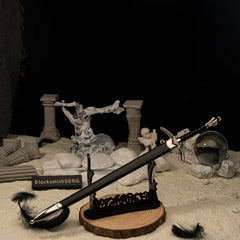 Glamdring replica — laid across the large display stand against a dark backdrop.