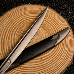 Orcrist replica — blade fuller with engraved script beside the scabbard's swirl-worked chape.