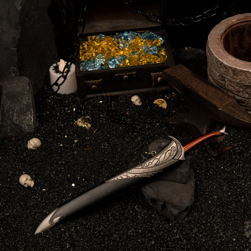 Orcrist replica — wider view of the handcrafted hoard set with a gem-filled chest and hanging chains.