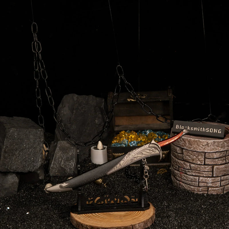 Orcrist replica — laid across the large display stand beside the treasure chest.