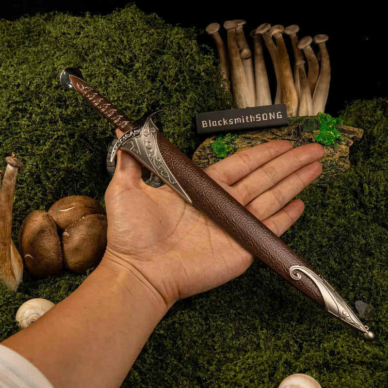 Sting replica (30cm die-cast zinc alloy blade) — held in hand for scale.