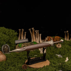 Sting replica — laid across the large display stand against a dark backdrop.