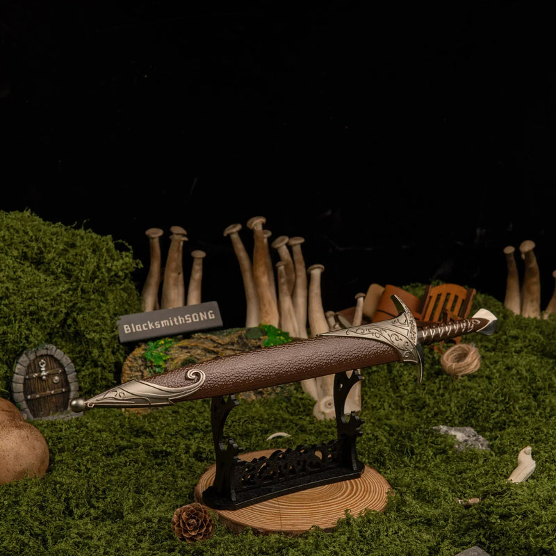 Sting replica — laid across the large display stand against a dark backdrop.