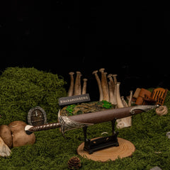Sting replica — set on the small display stand in the mossy set.