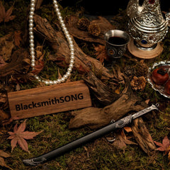 Thranduil's Sword replica — wider view of the handcrafted forest set with pearls, a silver goblet, and dried fruit.