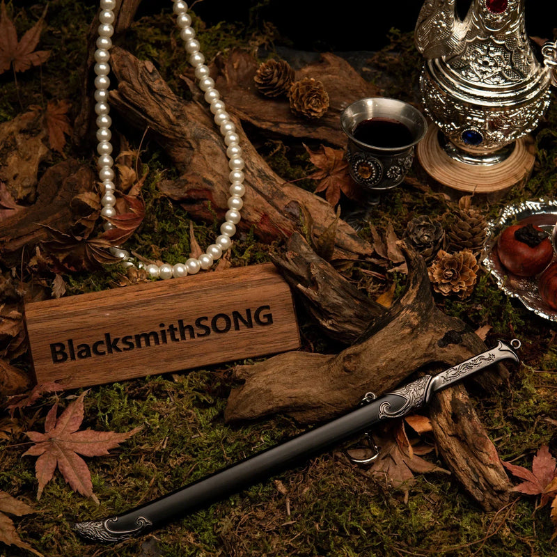 Thranduil's Sword replica — wider view of the handcrafted forest set with pearls, a silver goblet, and dried fruit.