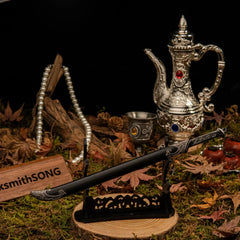 Thranduil's Sword replica — laid across the large display stand in the forest set.