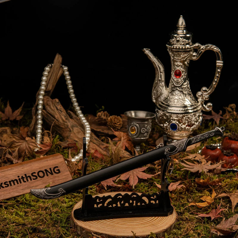 Thranduil's Sword replica — laid across the large display stand in the forest set.