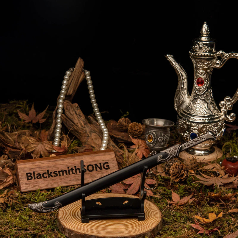 Thranduil's Sword replica — set on the small display stand against a dark backdrop.