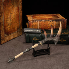 Fatalis Zaggespanon replica — on the Small Display Stand beside stacked books.